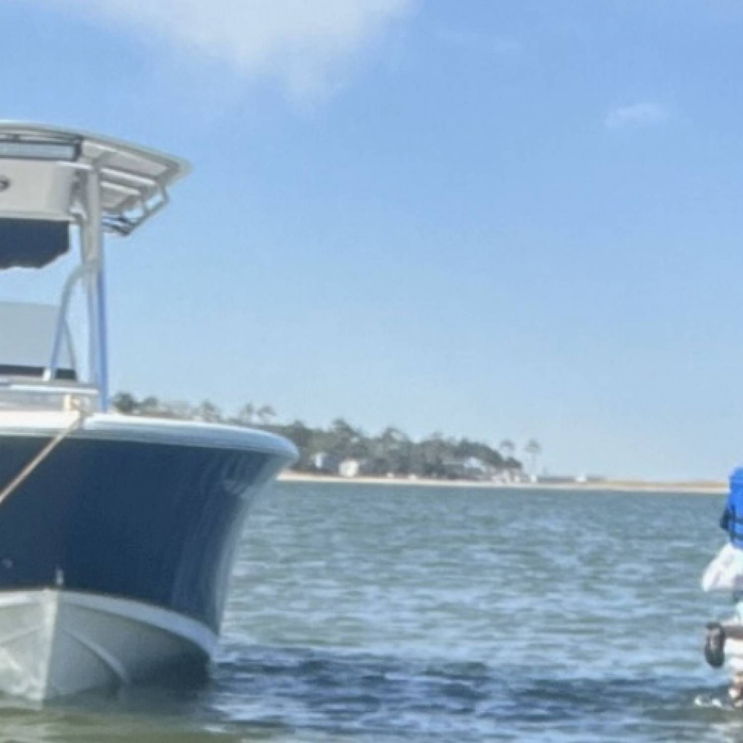 Carrying little man from boat to beach