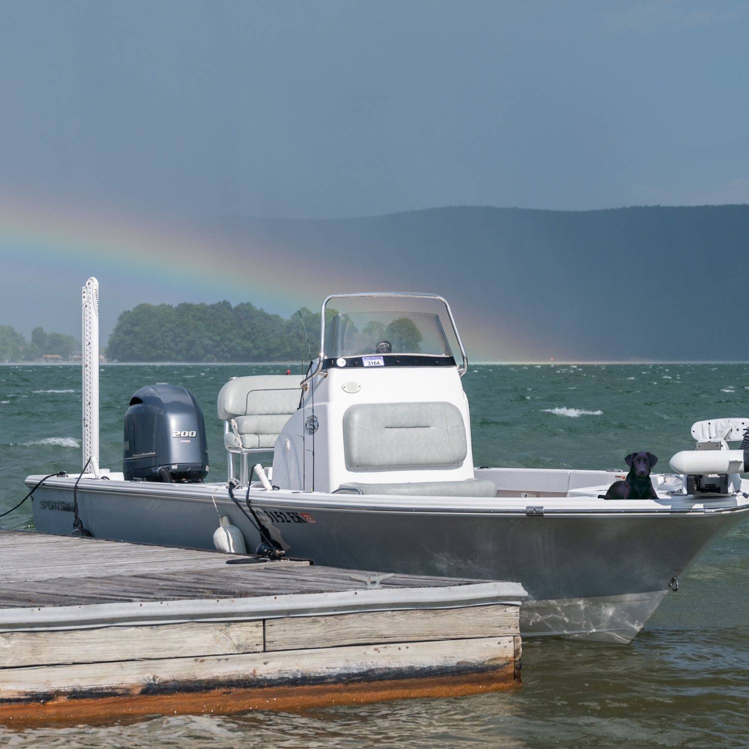 Storm rolled in with a rainbow so I got preacher to stay on the boat while I snapped a couple...