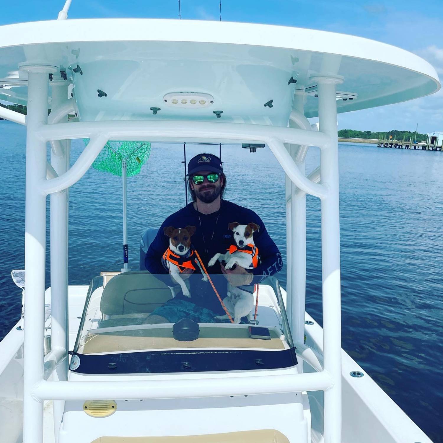 Title: Boat day with the pups - On board their Sportsman Masters 247 Bay Boat - Location: Jacksonville, FL. Participating in the Photo Contest #SportsmanSeptember