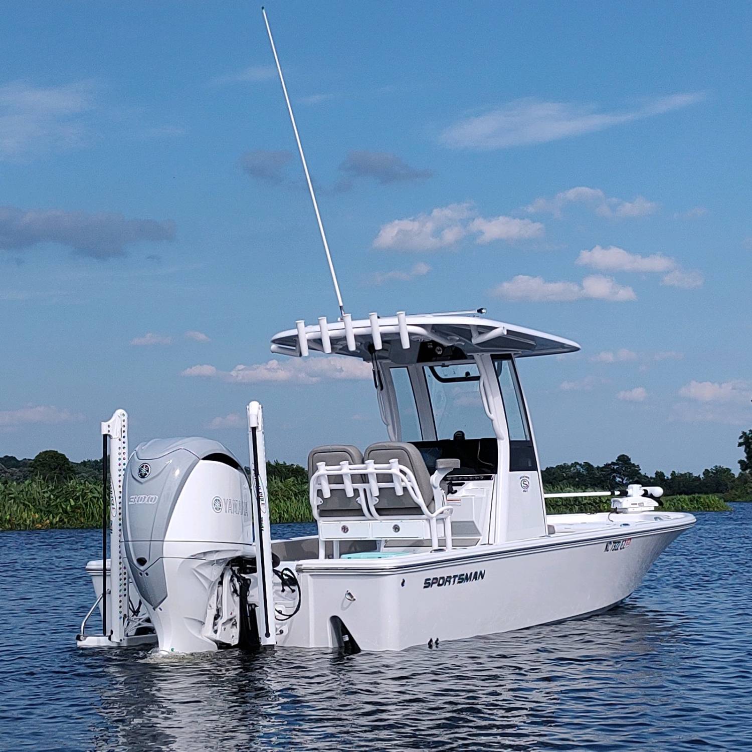 Back in a creek taking some photos after having the motor color matched to side and hull colors...