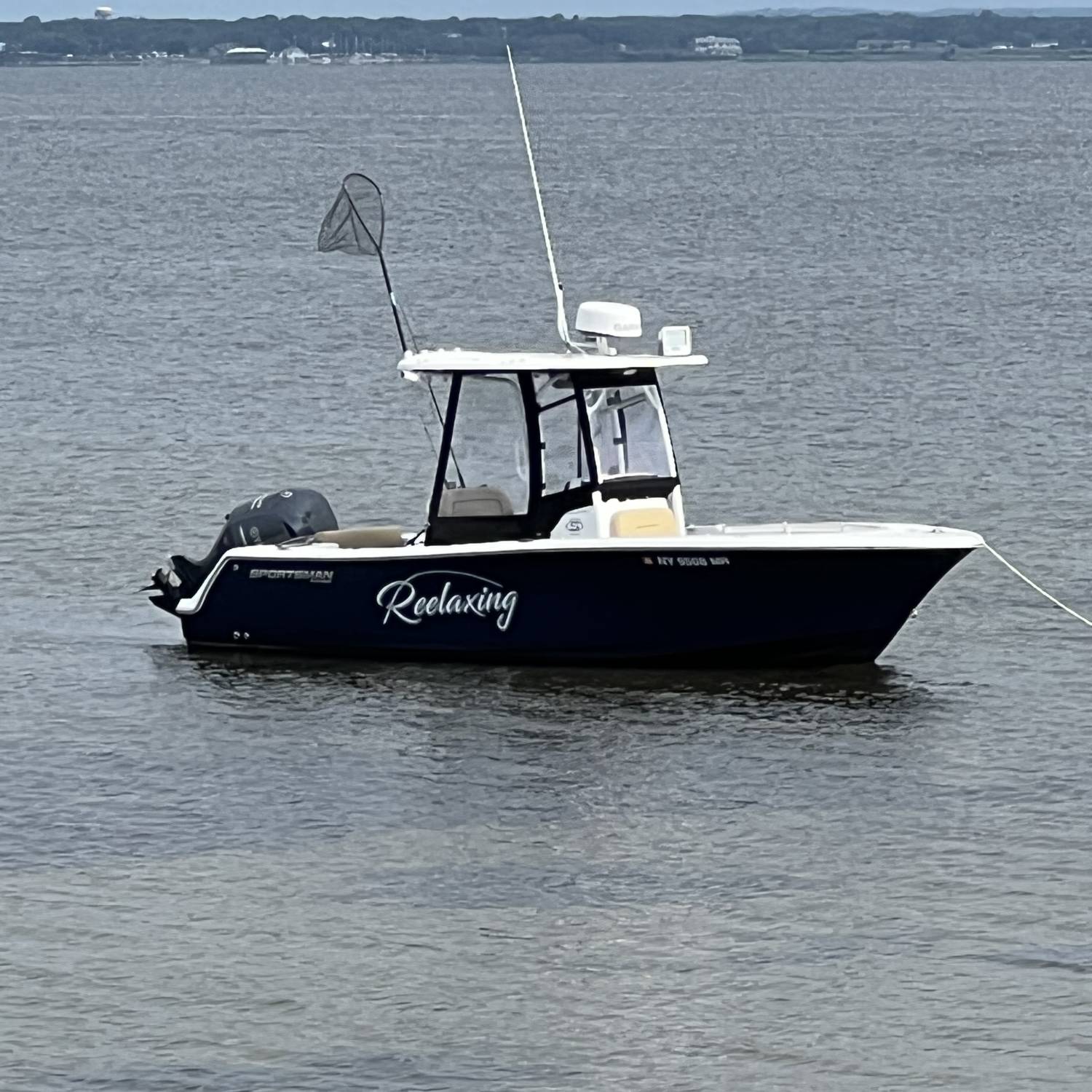 Title: Sittin pretty - On board their Sportsman Open 232 Center Console - Location: Davis park. Participating in the Photo Contest #SportsmanAugust2023