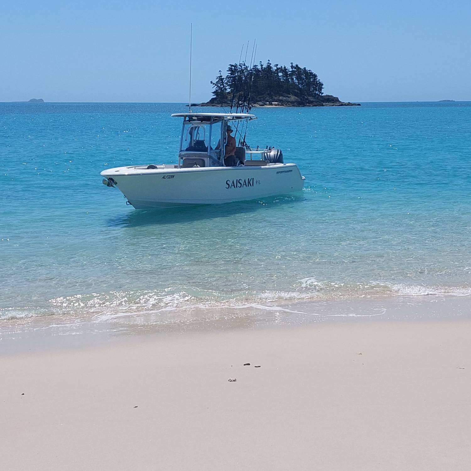 Having a break from fishing on a deserted beach  near Whitehaven Beach in the beautiful  Whitsunday Islands in Australia.