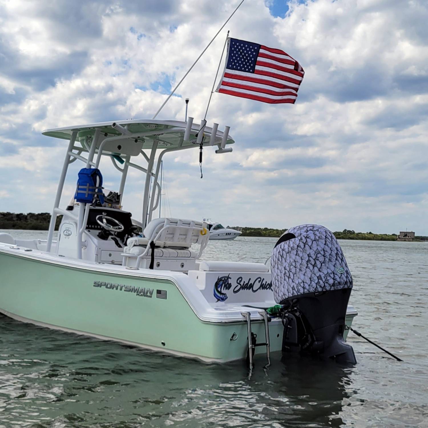 Our 2021 Open 212 Platinum anchored at the sandbar flying the flag proudly. Enjoying some much needed time off!