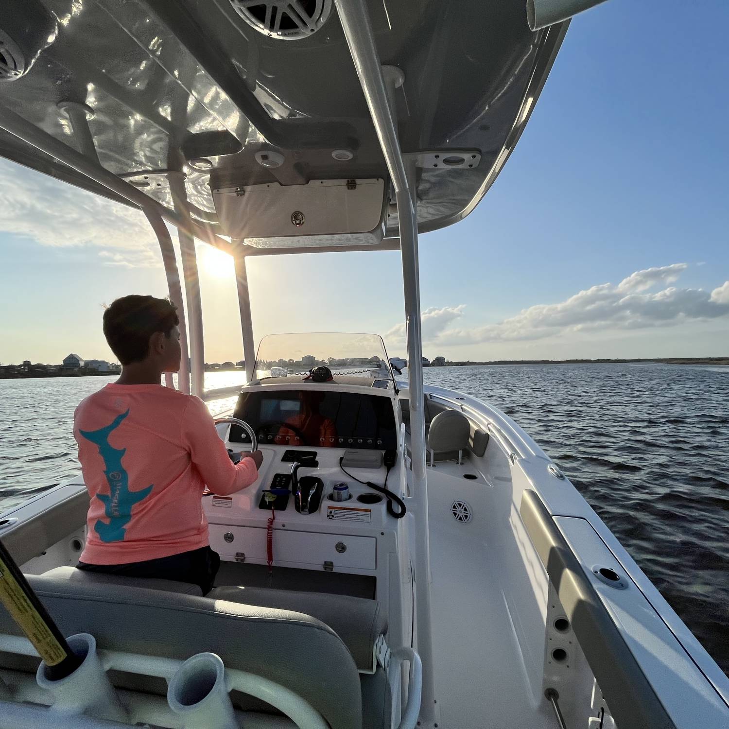 My son driving back to the dock after a successful fishing trip.