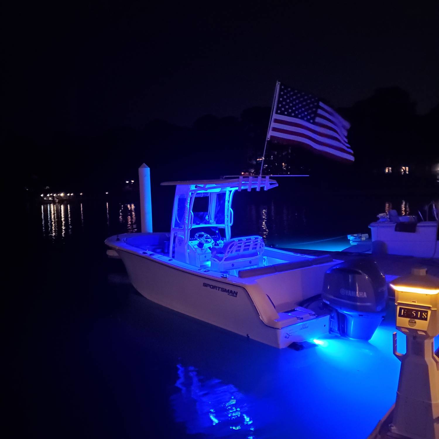 Title: Dinner at night - On board their Sportsman Heritage 231 Center Console - Location: Long Creek, Virginia Beach. Participating in the Photo Contest #SportsmanJune2023