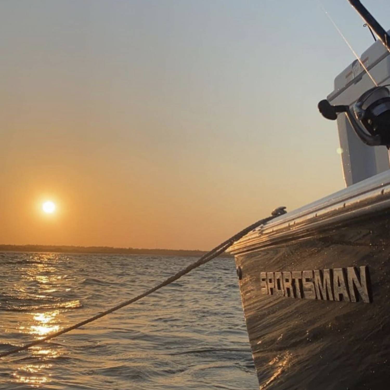 Sunset with sportsman logo