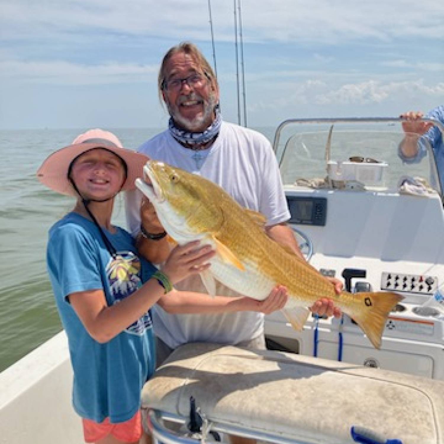 Young lady with her very first bull red on light tackle.