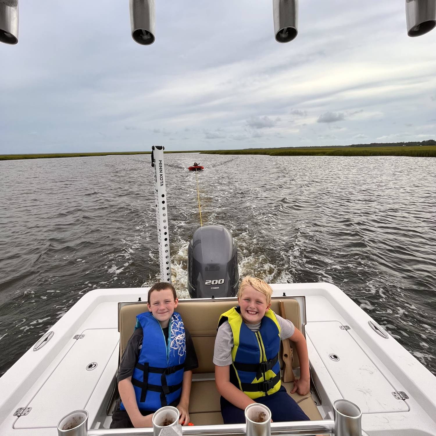 Title: Taken turns on the tube - On board their Sportsman Masters 227 Bay Boat - Location: St Simons GA. Participating in the Photo Contest #SportsmanFebruary2024