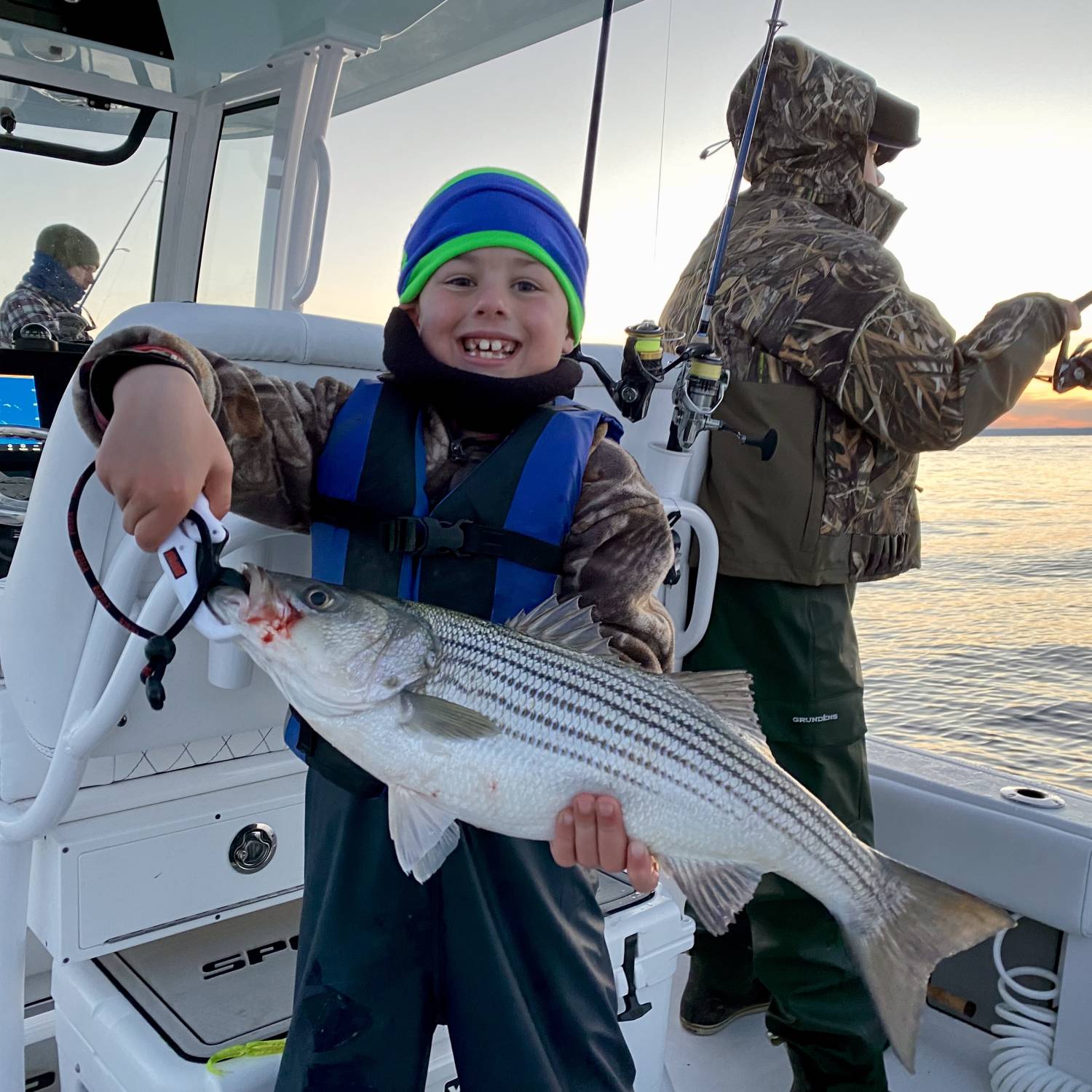 Title: Winter stripers - On board their Sportsman Masters 247OE Bay Boat - Location: Chesapeake Bay. Participating in the Photo Contest #SportsmanJanuary2024