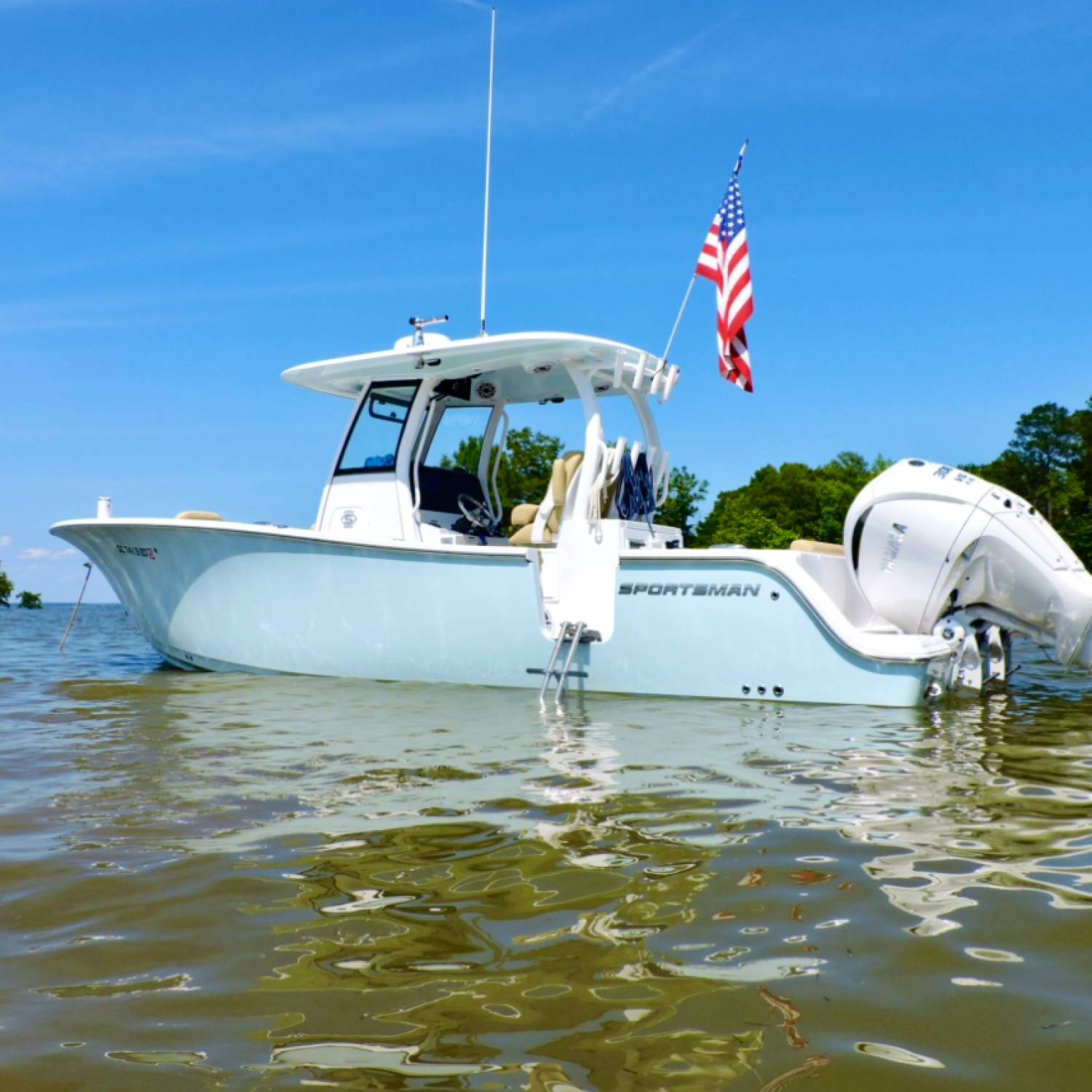 Open 282 anchored out at the sandbar