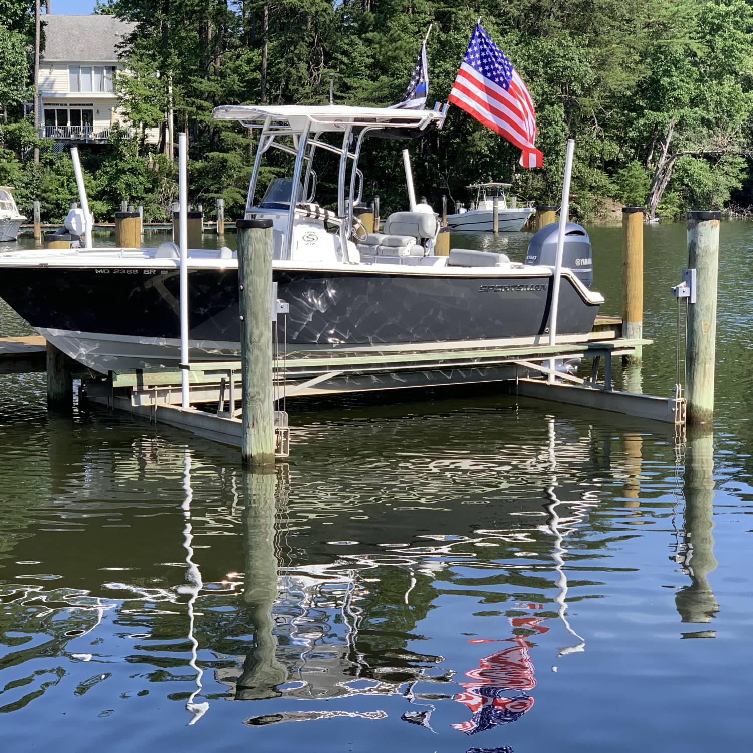 Sportsman 2020 212, Shark Gray resting on her lift just waiting for her next water adventure!