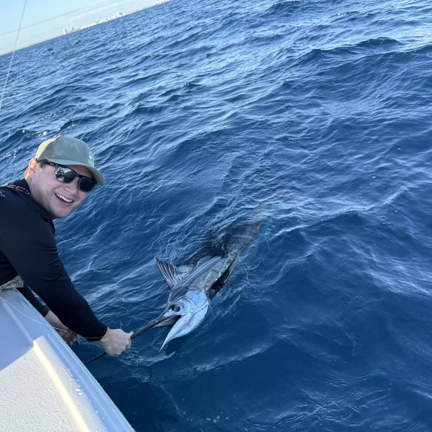 Flying a kite and landing sails off a 24 foot bay boat is not something you see every day, but...
