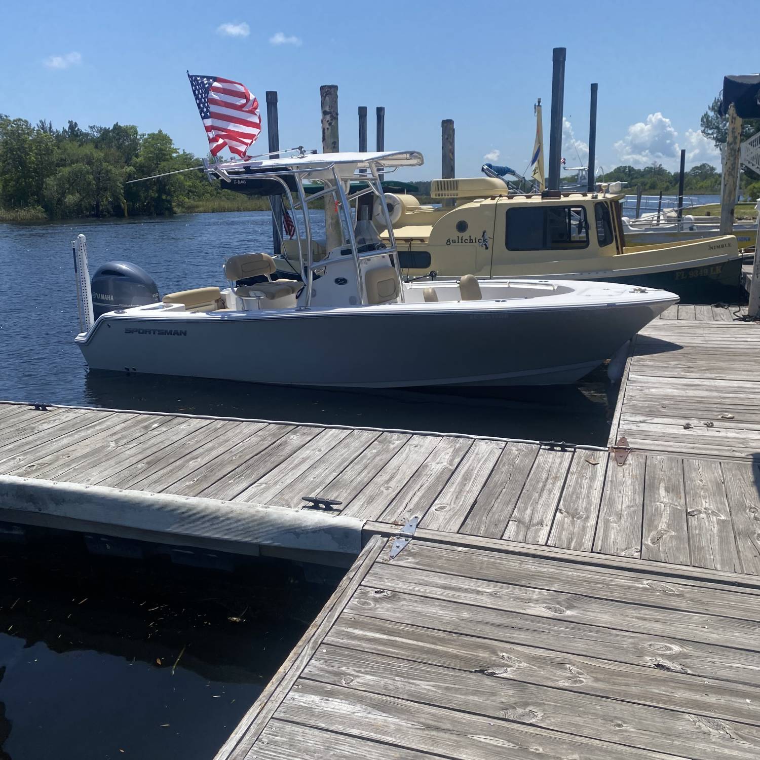 A 2017 sportsman 212 open docked and waiting to go back on the water after a lunch break.