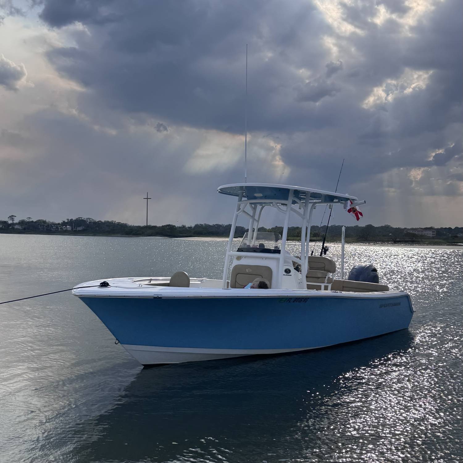 Parked at a sandbar on Matanzas River, my 5 year old daughter is asleep up front. Tired from a...